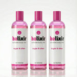 Three bottles of Helixir sugar & shea body elixir on a white background